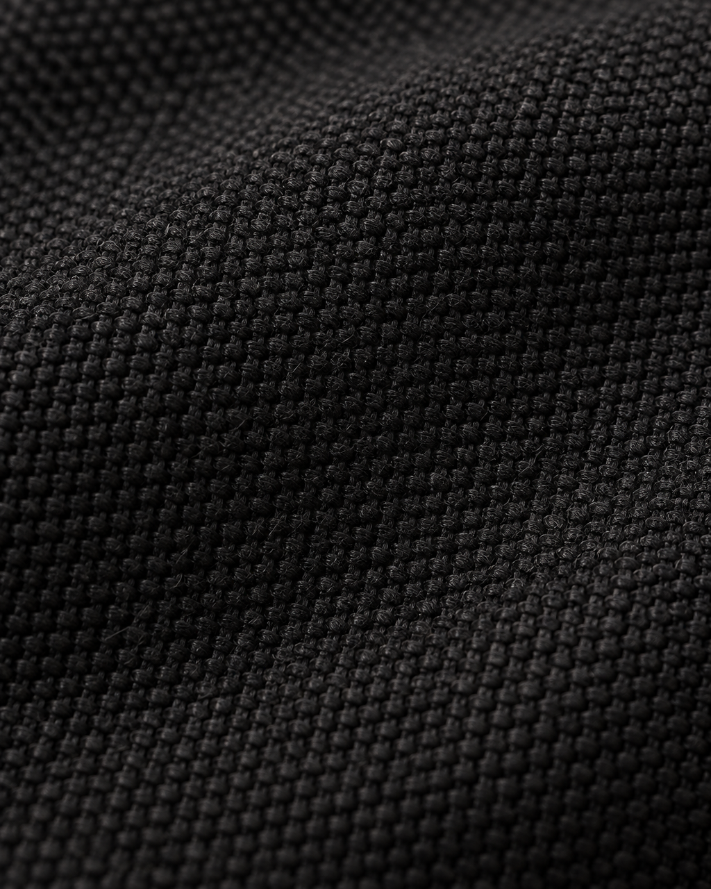 Black canvas weave texture of the Canvas Messenger Bag Urban Refined