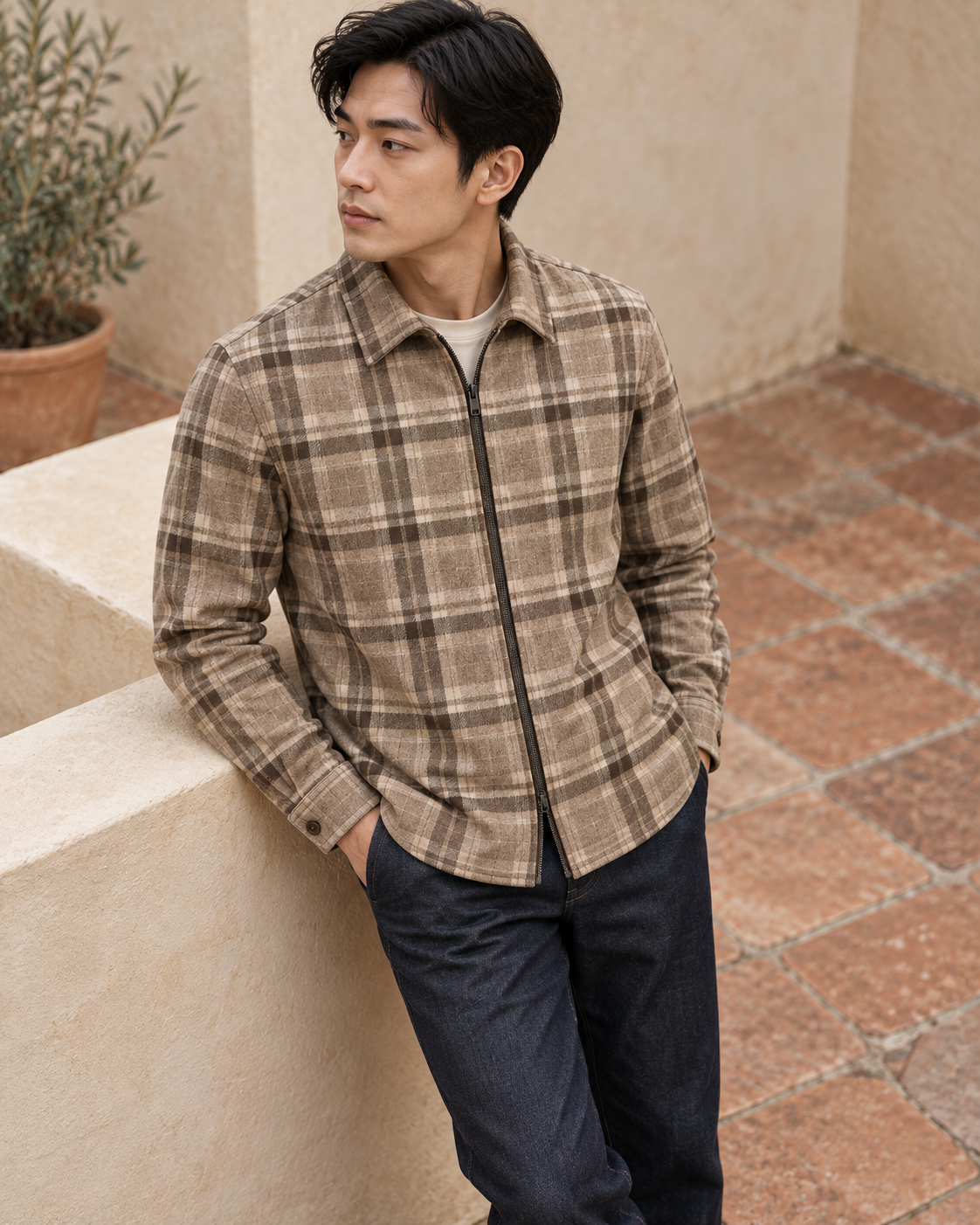 Man wearing Check Overshirt Modern Refined in a sheltered courtyard