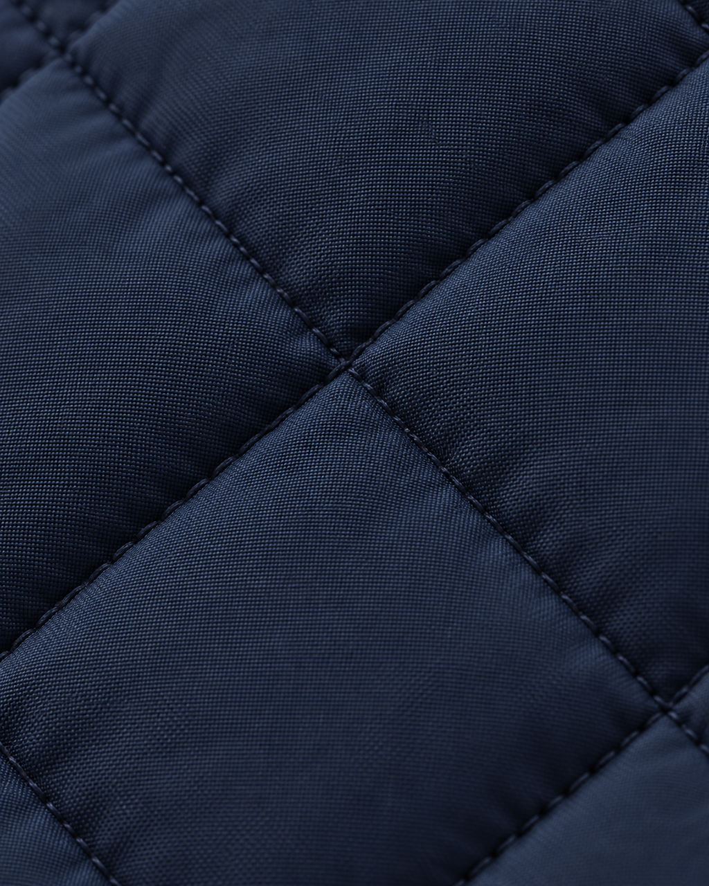 Navy diamond quilting texture of the Quilted Gilet Classic Refined