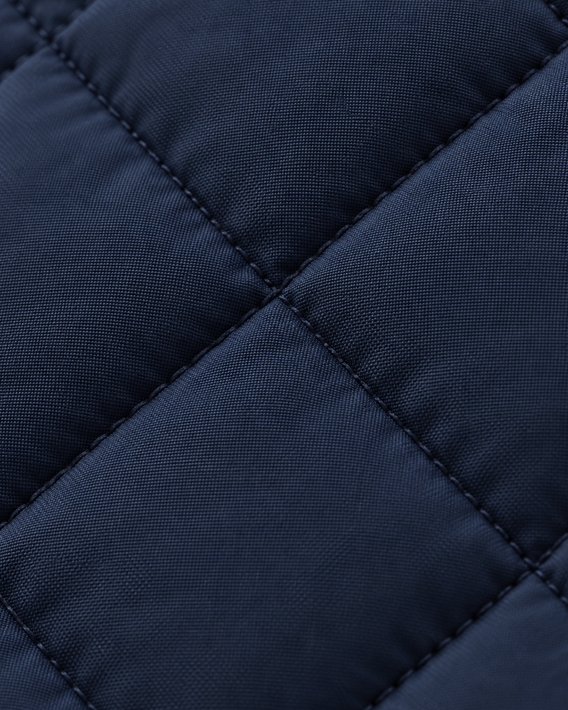 Navy diamond quilting texture of the Quilted Gilet Classic Refined