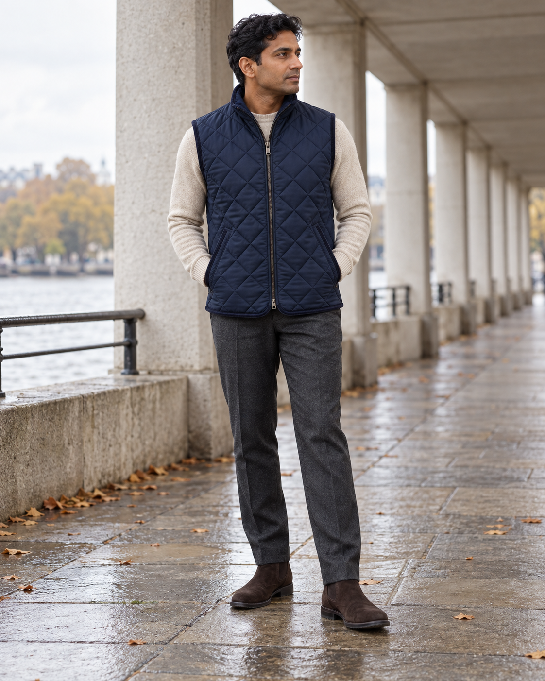 Man wearing the Quilted Gilet Classic Refined on a covered riverside walkway